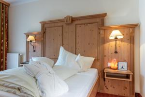 Postel nebo postele na pokoji v ubytování Hotel Gletscherblick