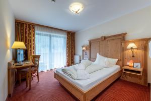 Postel nebo postele na pokoji v ubytování Hotel Gletscherblick