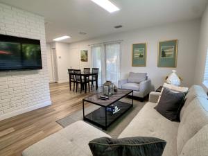 a living room with a couch and a table at Harbourside Flats in Fort Lauderdale