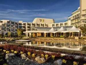 a rendering of the exterior of a hotel at Inn at Laurel Point in Victoria