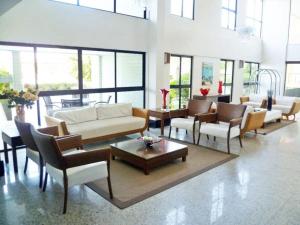 Zona de estar de Flat 2 Quartos Com Vista Para o Mar e Serviços Hoteleiros