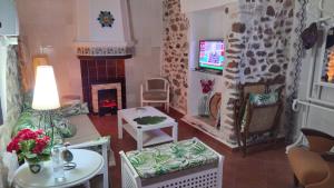 TV a/nebo společenská místnost v ubytování Rosita Casa Rural