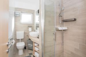 Kúpeľňa v ubytovaní Apartmani Rišpet
