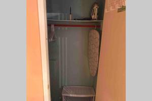a small closet with a shelf and a towel at Fresh Private Apartment Lower level- 2 beds in Brampton
