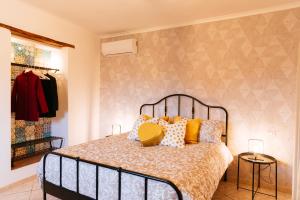 a bedroom with a bed with pillows on it at Casa Aragona b&b in Capua