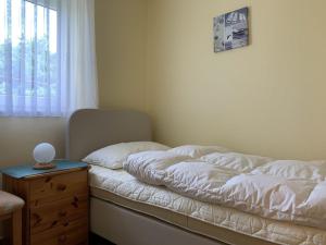 Postel nebo postele na pokoji v ubytování Haus-Sonnenwinkel-Bungalow-12