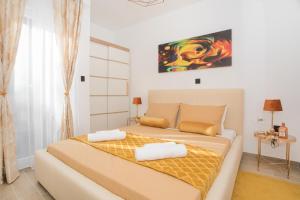Posteľ alebo postele v izbe v ubytovaní Apartmani Rišpet
