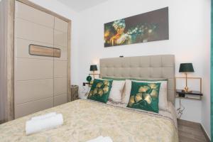Posteľ alebo postele v izbe v ubytovaní Apartmani Rišpet