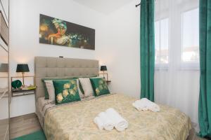 Posteľ alebo postele v izbe v ubytovaní Apartmani Rišpet