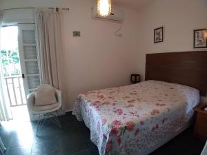 Uma cama ou camas num quarto em Casa Villaggio Beira-mar