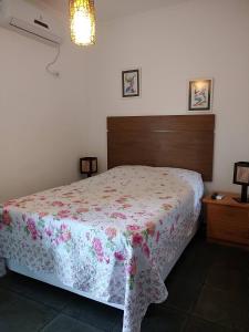 Uma cama ou camas num quarto em Casa Villaggio Beira-mar