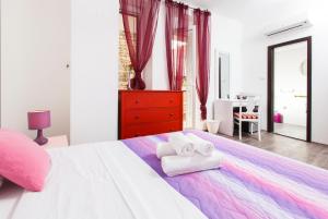 Postel nebo postele na pokoji v ubytování Prior Suites Split