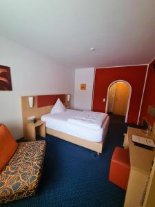 Postel nebo postele na pokoji v ubytování Hotel Silberhorn