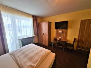 Postel nebo postele na pokoji v ubytování Hotel Silberhorn