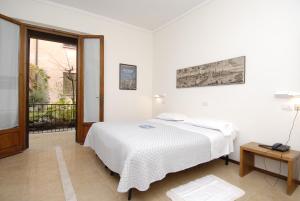 Voodi või voodid majutusasutuse Albergo Bianchi Stazione toas