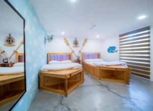 Krevet ili kreveti u jedinici u objektu Sinar Eco Resort