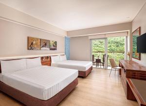 Voodi või voodid majutusasutuse Pico Sands Hotel toas