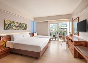 Voodi või voodid majutusasutuse Pico Sands Hotel toas