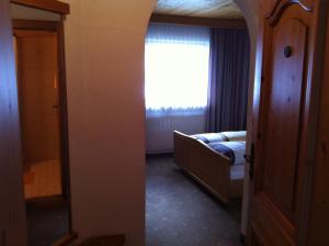 Postel nebo postele na pokoji v ubytování Hotel Garni Pfandl