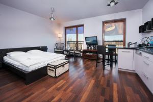 Posteľ alebo postele v izbe v ubytovaní Szafarnia Apartments Old Town