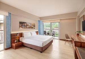 Voodi või voodid majutusasutuse Pico Sands Hotel toas