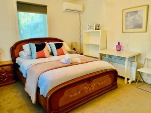 a bedroom with a large bed and a window at Yes home in Konagaderra