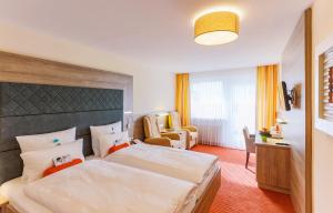 Postel nebo postele na pokoji v ubytování Kur- und Wellnesshotel Förch