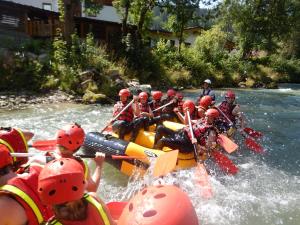 a group of people in a raft on a river at Bergblick-Planai - 5 Schlafzimmer plus eigene Sauna in Schladming