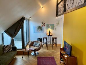 a living room with a couch and a table at Camino Home 2 in Cluj-Napoca