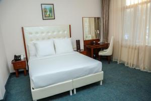 Vuode tai vuoteita majoituspaikassa Kecharis Hotel and Resort