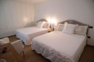 Postel nebo postele na pokoji v ubytování Residenza Lombardi