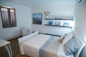 Postel nebo postele na pokoji v ubytování Residenza Lombardi