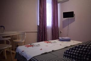 Łóżko lub łóżka w pokoju w obiekcie Mini Hotel Mango