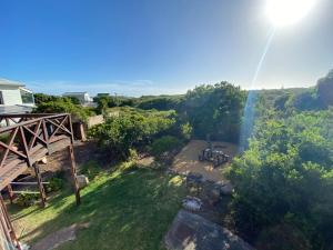 an aerial view of a backyard with a waterfall at Hemel in Hermanus Three bedroom Home in Hermanus +37 photos