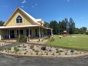 a house with a garden in front of it at The Residence @ Elbourne Wines in Lovedale