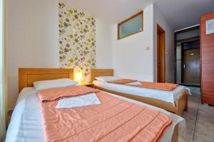 Postel nebo postele na pokoji v ubytování Konačište BRAĆA SEKULIĆI