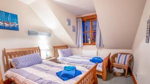 Ένα ή περισσότερα κρεβάτια σε δωμάτιο στο Osborne Steading