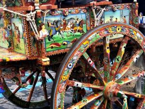 a colorful carriage with a painting on the side of it at B&B Polifemo Etna in Nicolosi