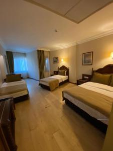 Postel nebo postele na pokoji v ubytování Hotel Büyük Levent