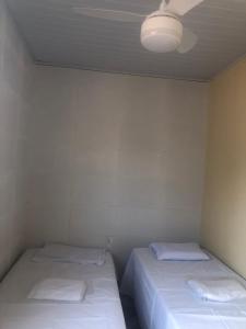 Säng eller sängar i ett rum på Casa na Praia de Barra do Gil