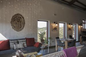 a living room with a couch and a table at Parga Natura Alojamiento in Parga