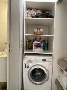 a washer and dryer in a small room at Amazing Savoya nr1 Loft Old City Center Self check-in in Timişoara