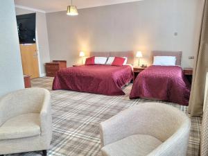 Ένα ή περισσότερα κρεβάτια σε δωμάτιο στο Cross Keys Hotel, Kelso