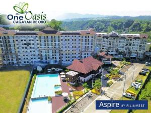 an aerial view of a large apartment building with a pool at Lou Condo Rental in Cagayan de Oro