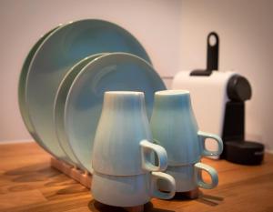 two blue and white vases sitting next to a mirror at Boutique Studio Magielsen in Amsterdam