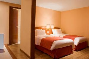 Postel nebo postele na pokoji v ubytování Hotel Moncloa