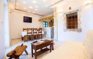 a living room with a couch and a table at Holiday Home Tonia in Baška Voda