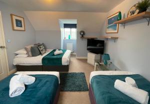 Uma área de estar em Short Stays, Beautiful Serviced Accommodation Bicester