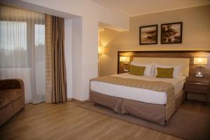 Tempat tidur dalam kamar di New Egreta Resort