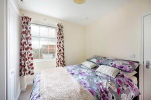 Ένα ή περισσότερα κρεβάτια σε δωμάτιο στο Becket apartment